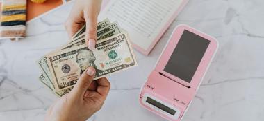 Person uses cash to pay for a transaction
